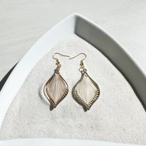 Bohemian style earring with thread.